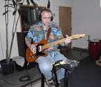 Photo of Nick Toth playing guitar.