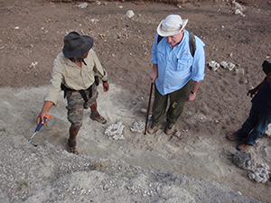 Jackson Njau and Jim Brophy invsitigating geology at Olduvai