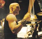 Photo of Kenny Aranoff playing drums.