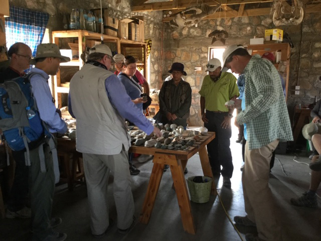 Workshop participants examine stone tools at Olduvai Gorge