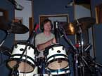 Photo of Tom Schoenemann playing drums.