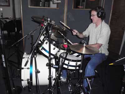 Tom on drums